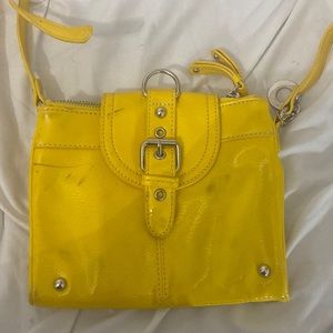 This is a nine west purse, there are some defects on the bag and strap